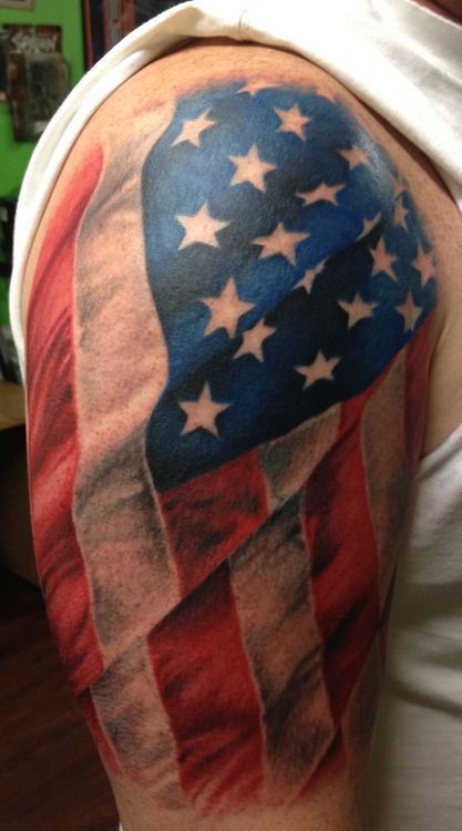 Awesome arm tattoo with flag