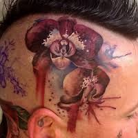 Head tattoo with orchids