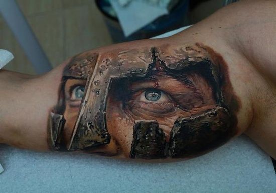 Face tattoo with blue eyes