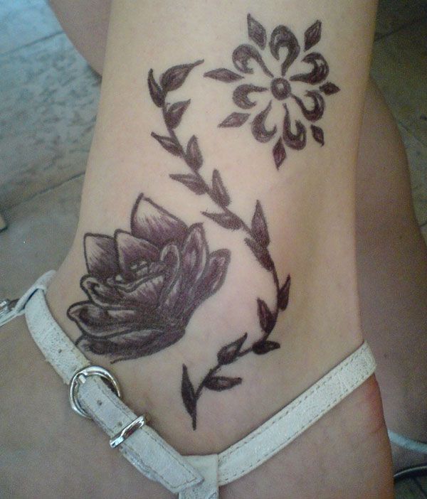 Tattoo with lotus on ankle