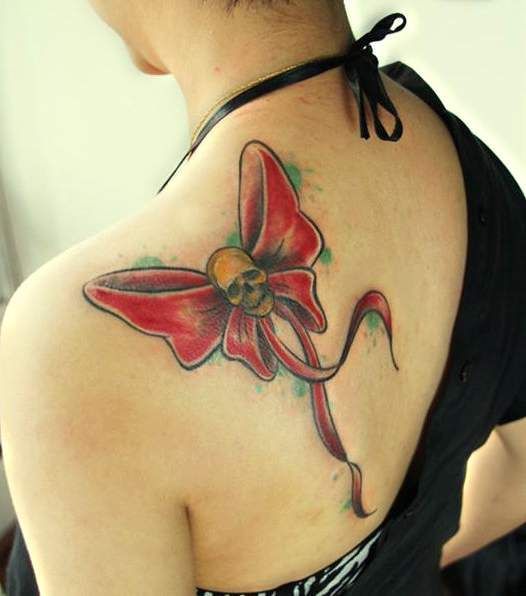 Red ribbon with skull tattoo