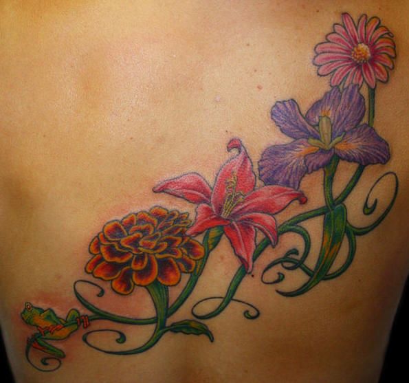 Flowers tattoo of hip