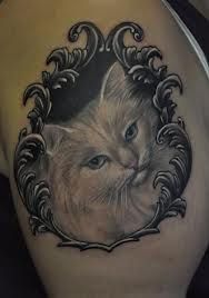 Shoulder tattoo with cat