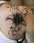 Wonderful lily flower on the shoulder