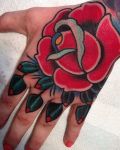 Hand tattoo with red rose