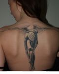 Angel tattoo on spine