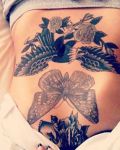 Belly tattoo with butterfly and wings