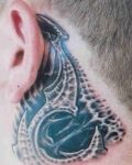 Biomechanical tattoo near ear