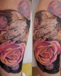 Bird and pink flowers tattoo
