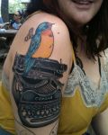Bird with machine tattoo