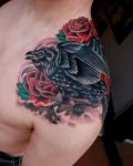 Black magpie and roses tattoo
