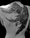 Black raven tattoo on back