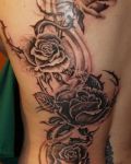 Black roses back tattoo