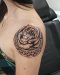 Black rose shoulder tattoo
