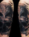 Dark face and skull tattoo