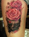 Dark skull with roses tattoo
