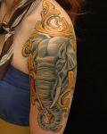 Elephant and gold ornaments tattoo