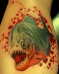 Fish with teeth tattoo