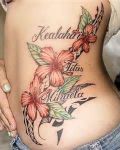 Flowers and names tattoo