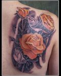 Three orange roses and birds tattoo