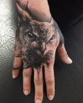 Owl tattoo on hand