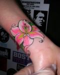 Pink lily wrist tattoo