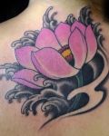 Pink lotus on black water tattoo