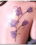 Purple flowers tattoo