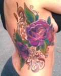 Purple flowers with leafs tattoo