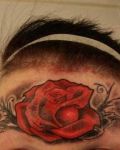 Red rose on her forehead