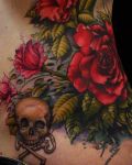 Roses and skull hip tattoo