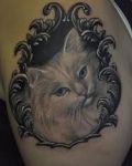 Shoulder tattoo with cat