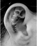 Skull tattoo in ear