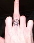Black skull on finger