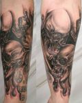 Skulls tattoo on calf
