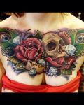 Chest tattoo with skull diamonds and roses