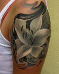 White and grey lily tattoo