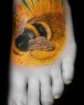 Yellow bee and sunflower tattoo