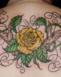 Yellow rose tattoo on back