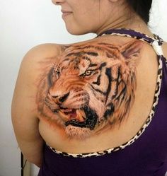Tiger head on the back tattoo