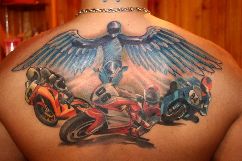 Wings and motor cyclist tattoo