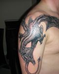 Black dragon on arm