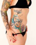 Tattoo with fish, flowers and woman